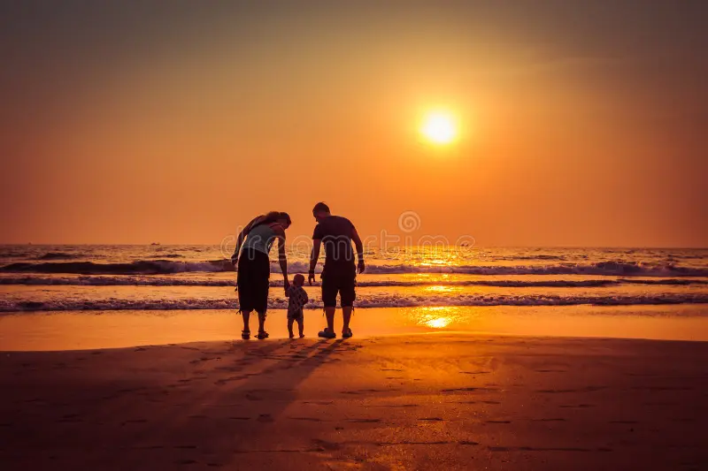 happy-family-sunset-beach-arambol-beach-north-goa-india-90985572
